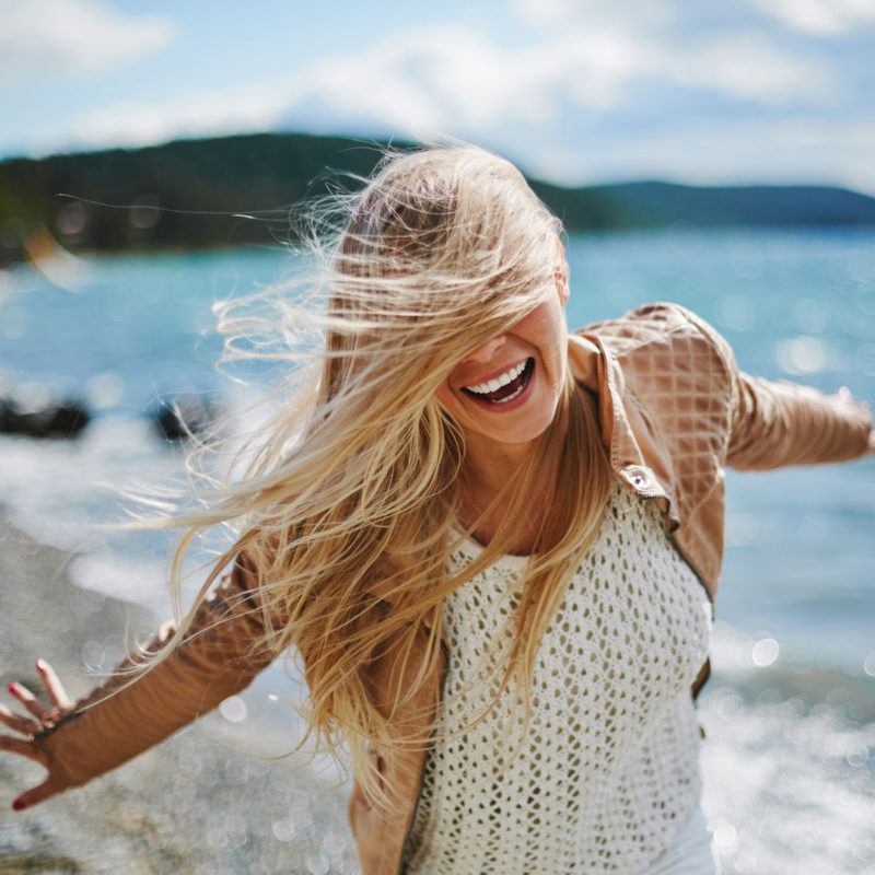 Blonde woman having fun and acting happy