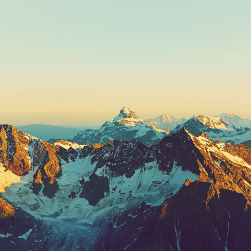 49138781 - alpine landscape with peaks covered by snow and clouds. natural mountain background