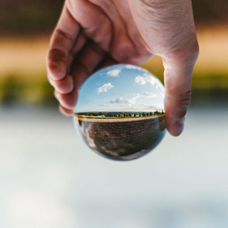 opposite thinking seen through glass ball