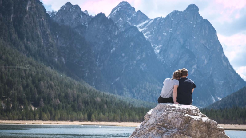 Authentic couple contemplating the mountains