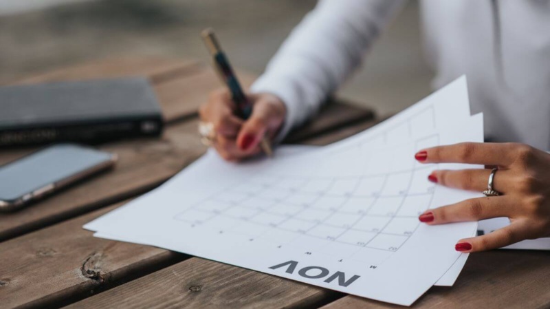 Woman scheduling her subconscious mind exercises in a planner