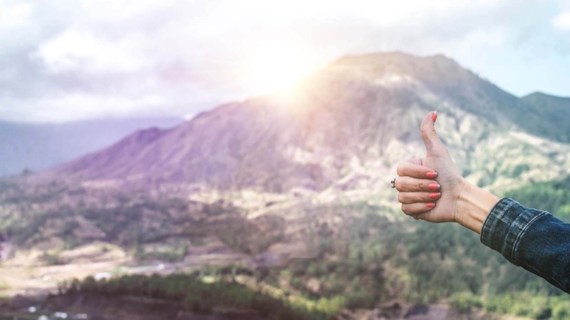 Writing positive affirmations (symbolized by a thumbs up)