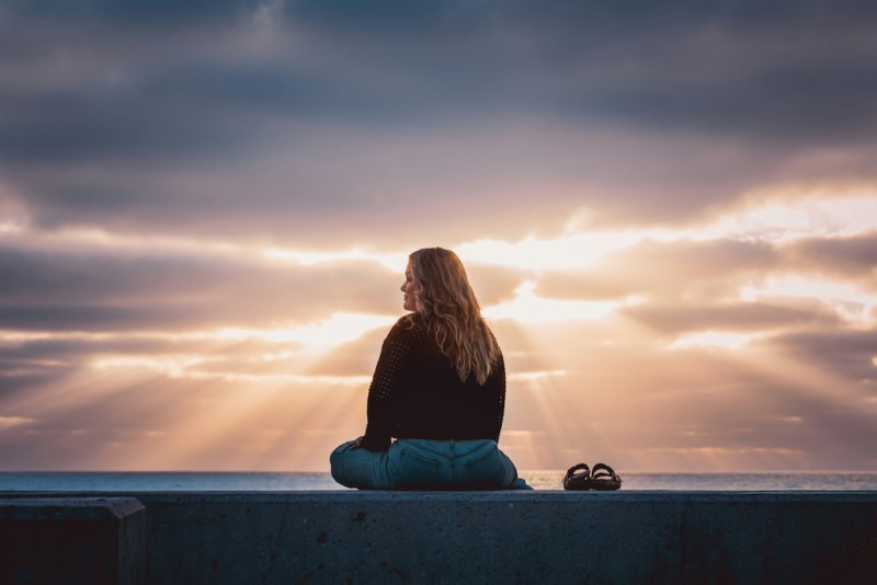Women thinking by the ocean